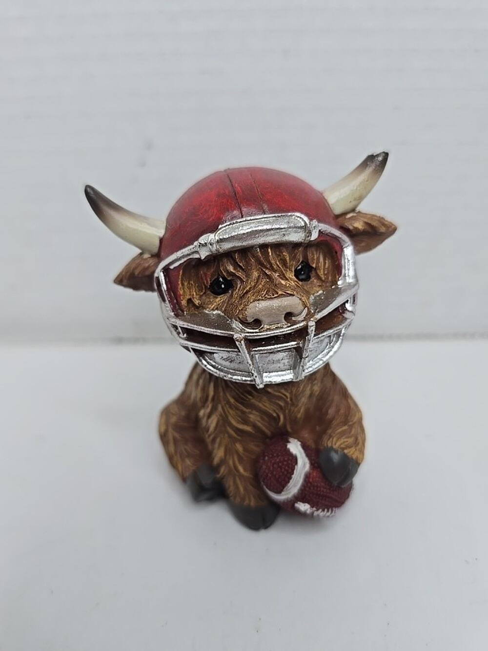 Adorable Highland Cow With Football